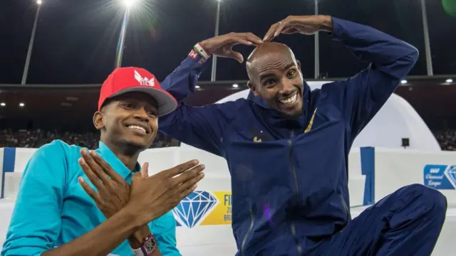 Mo Farah of Great Britain makes a heart sign and Mutaz Essa Barshim of Qatar makes a wings sign during the Diamond League Athletics meeting in August 2017