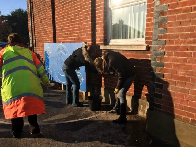 Repairing damage at the school