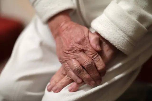 The hands of an elderly person