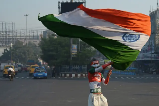 Man waves an India flag