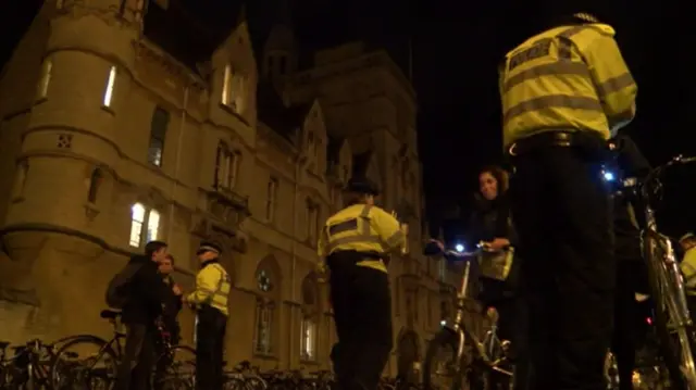 Police checking lights on bikes