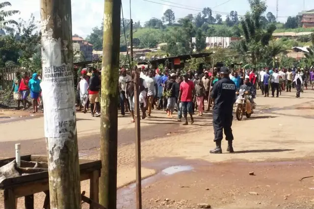 Demonstrators march during a protest against perceived discrimination in favour of the country's francophone majority on September 22, 2017 in Bamenda