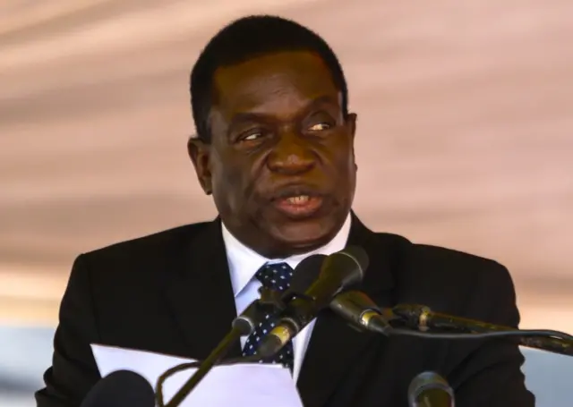 This file photo taken on January 7, 2017 shows Zimbabwe acting President Emmerson Mnangagwa speaking during the funeral ceremony of Peter Chanetsa at the National Heroes Acre in Harare