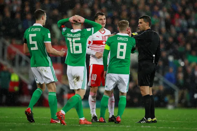 The referee gives a penalty