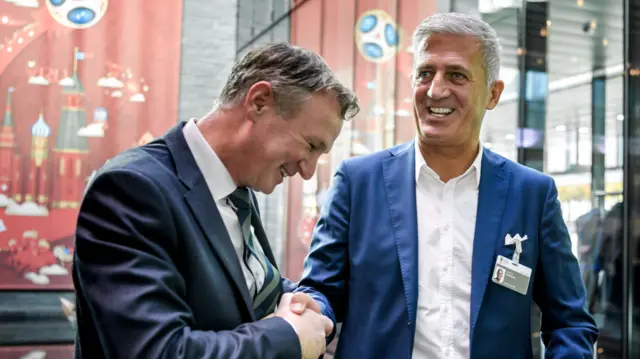 Northern Ireland coach Michael O'Neill (left) shakes hands with Switzerland's coach Vladimir Petkovic