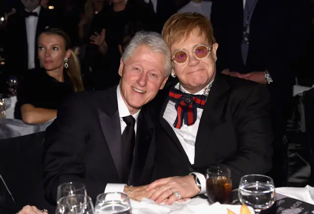 Elton John and Bill Clinton (l)