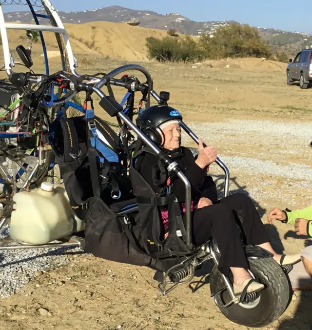 Connie Smith landing on the ground after paragliding