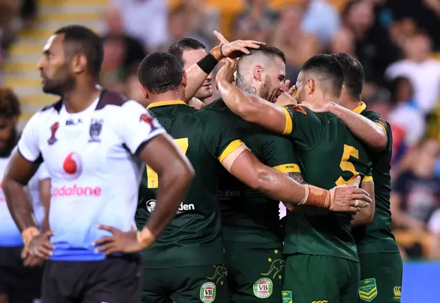 Australia celebrate a try against Fiji in the semi-finals