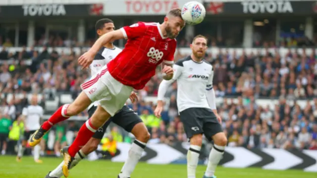 Daryl Murphy wins a header against Fulham