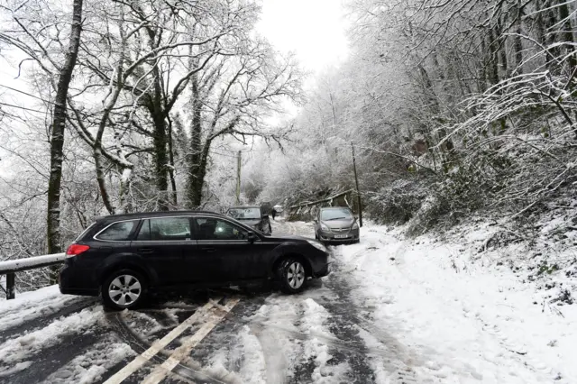 A40 near Sennybridge in Powys blocked by snow and fallen trees