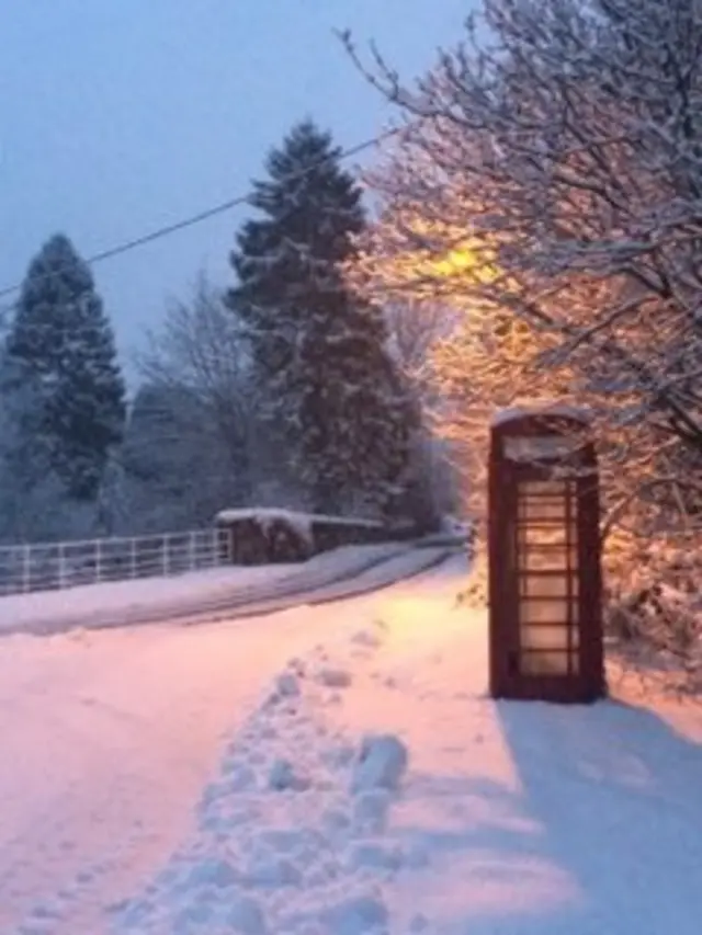 A phone box in snow