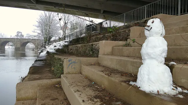 Snowman under the bridge fishing in Hereford