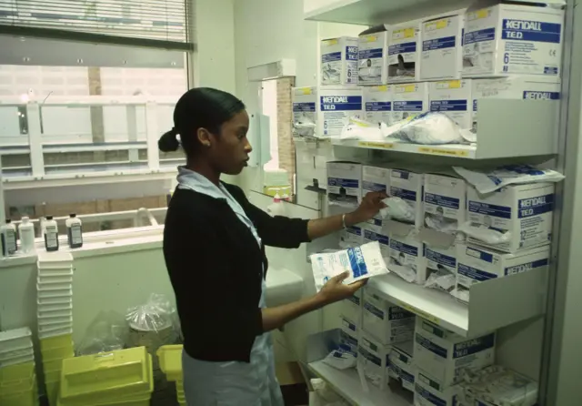 Nurse checks medical supplies