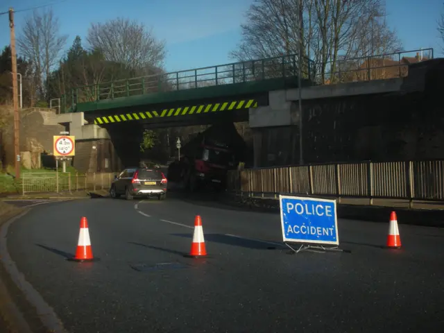 Lorry under bridge