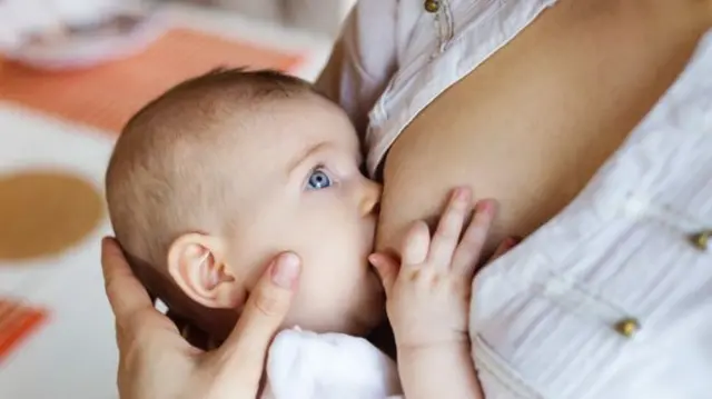 Baby being breastfed