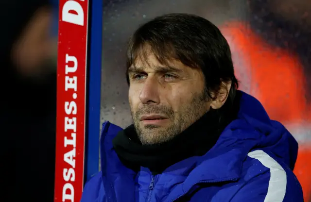 Antonio Conte looks on
