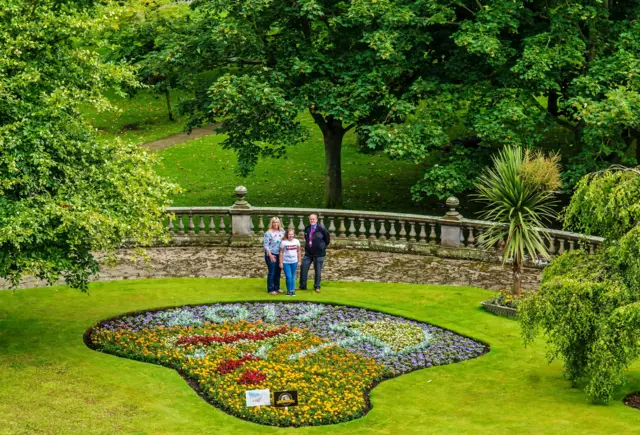 The 2017 winner designed by Milly Harman-Bevan, with her mum and Martin Burnhill, senior coastal service manager