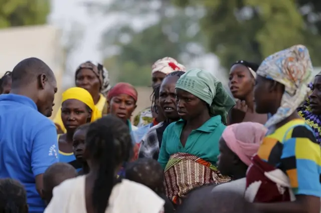 Women displaced by Boko Haram violence residing at the IDP camp yola listen to instructions