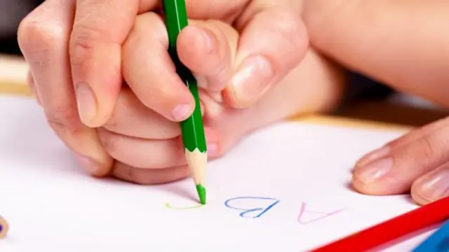 Anonymous photo of child being taught at school