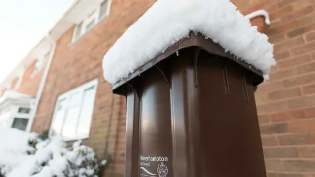 Bin covered in snow