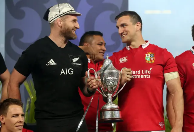 New Zealand captain Kieran Read and Lions captain Sam Warburton lift the 2017 series trophy together