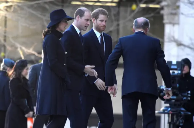 The Duke and Duchess of Cambridge and Prince Harry arrive at the service