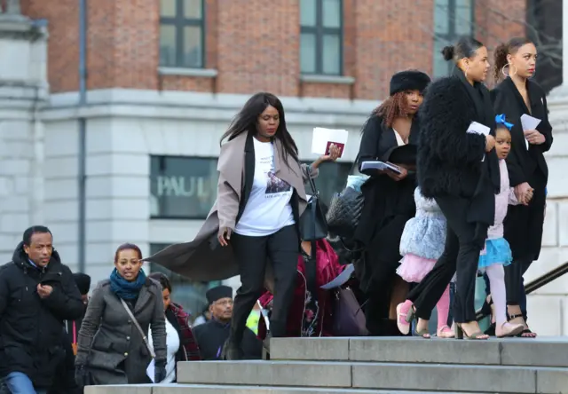 People arrive for the memorial service for Grenfell victims