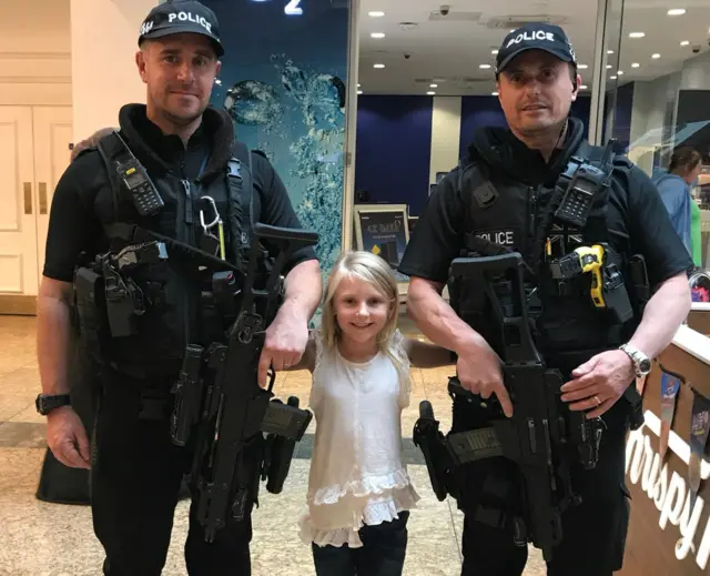 Little girl with officers