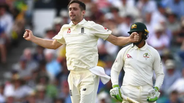 Chris Woakes of England celebrates after taking the wicket of Usman Khawaja