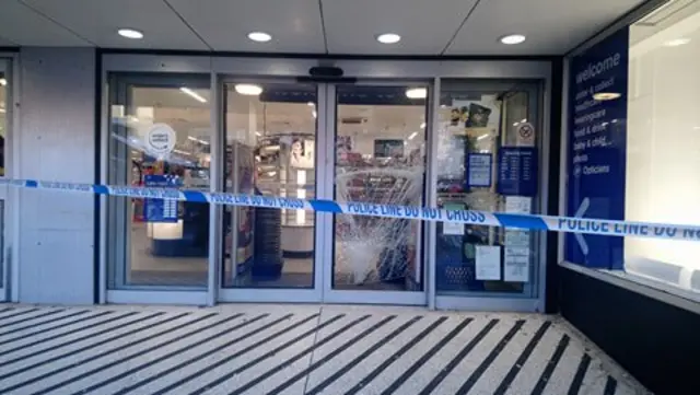 Smashed doors at the Boots