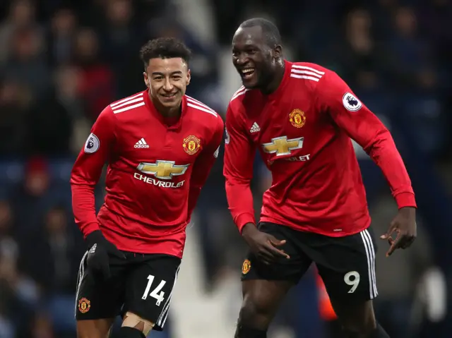 Jesse Lingard (left) celebrates with team-mate Romelu Lukaku