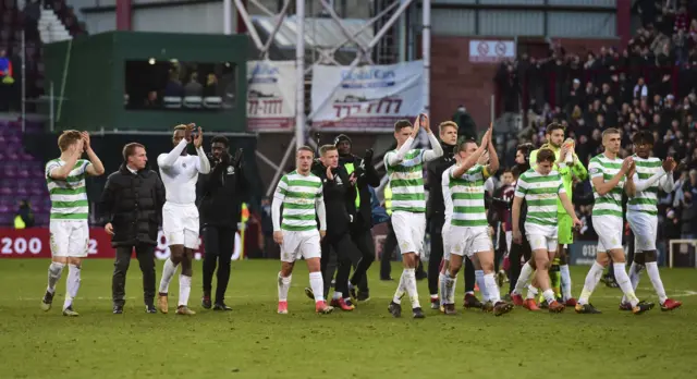 Celtic players applaud their fans at Tynecastle