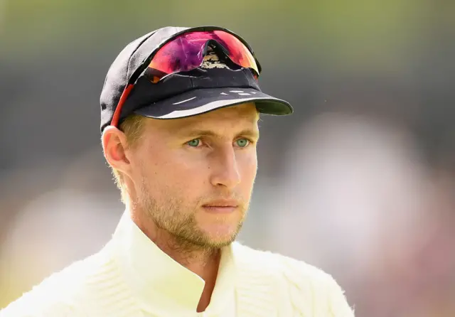 Joe Root of England looks on