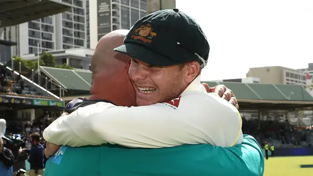 Steve Smith of Australia and Australian Head Coach Darren Lehmann celebrate