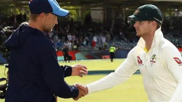 Joe Root shakes the hand of Australian Captain Steve Smith