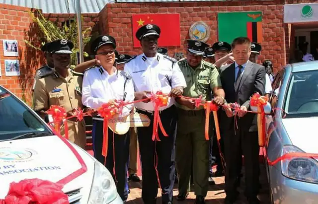 Police officers cut ribbon