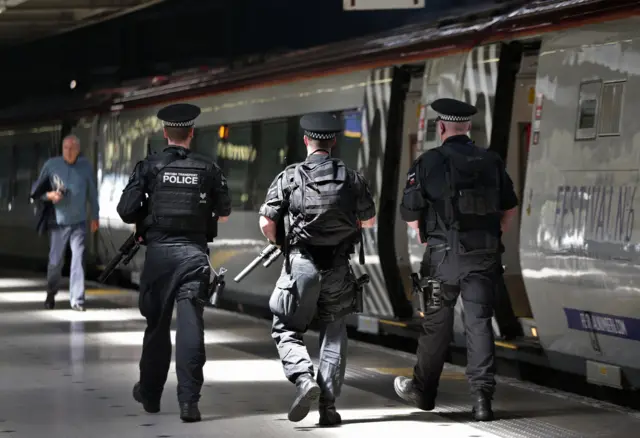 armed police at station