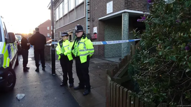 Officers outside the centre