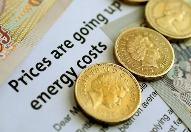 Pound coins on an energy bill