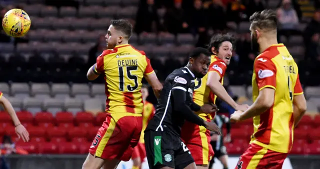 Partick Thistle's Adam Barton (second from right) heads into his own net against Hibernian