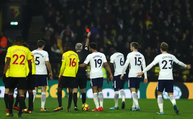 Davinson Sanchez of Tottenham Hotspur is shown a red card