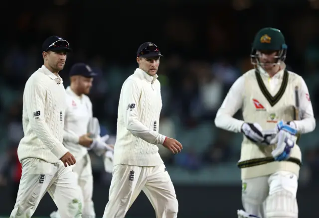 England captain Joe Root (centre)