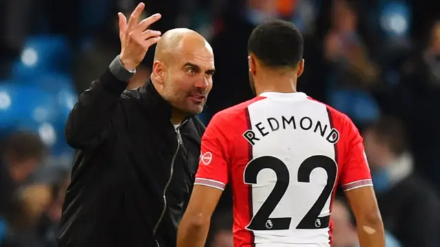 Pep Guardiola and Nathan Redmond