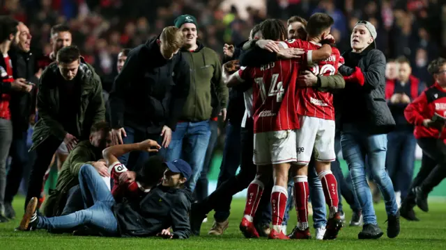 Bristol City fans invade the pitch