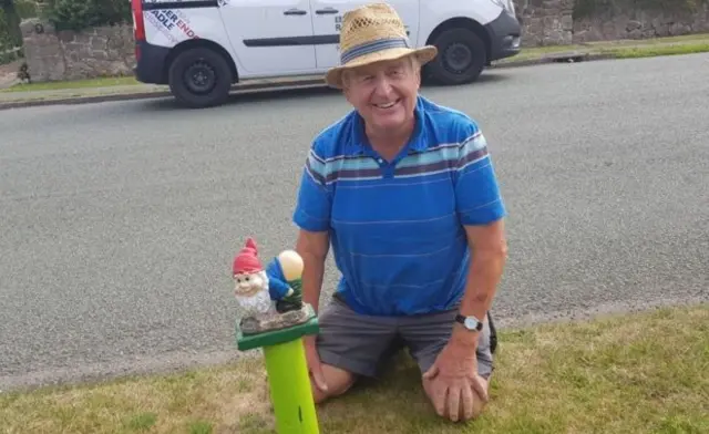 Laurence Perry with bottom-baring gnome