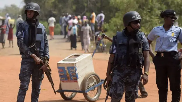 Police officers stand guard during the 2016 election in Ghana