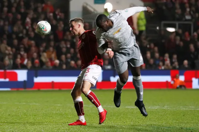 Manchester United's Romelu Lukaku heads at goal