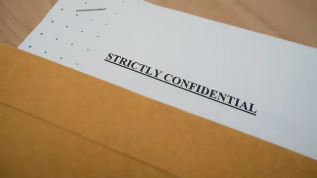 A document that reads: Strictly confidential