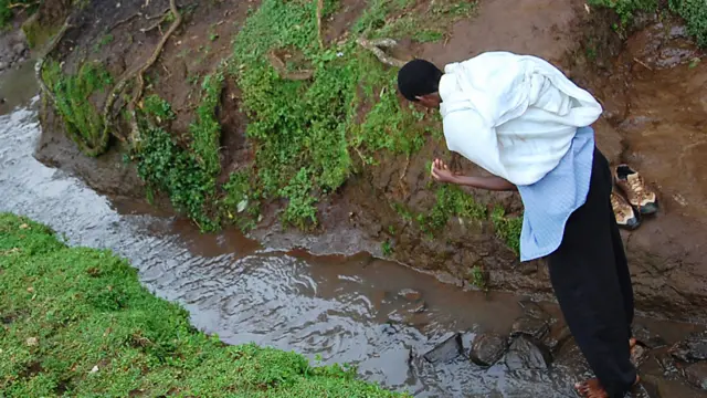 A man by a stream in northern Ethiopia