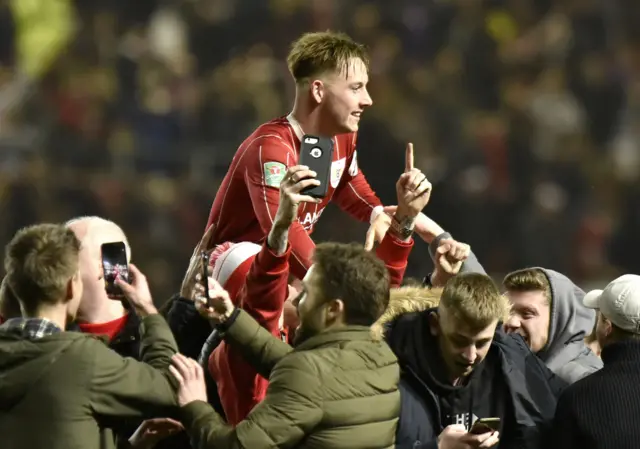 The Bristol City fans celebrate after the final whistle